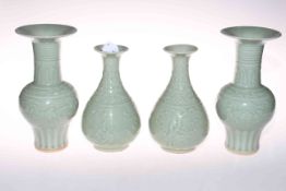 Two pair of Chinese green celadon glaze vases, 24cm and 20cm high.