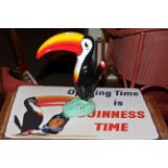Guinness model of toucan and Guinness sign.