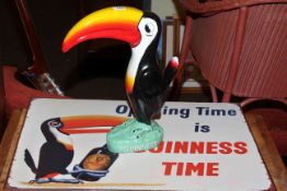 Guinness model of toucan and Guinness sign.