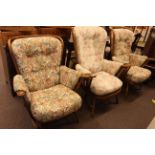 Three Ercol armchairs in floral print fabric.