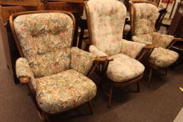 Three Ercol armchairs in floral print fabric.