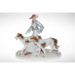 Large Porcelain figurine group of Art Deco lady with dogs, 36cm high.