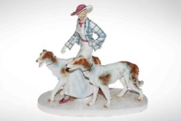 Large Porcelain figurine group of Art Deco lady with dogs, 36cm high.