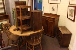 Circular pine table, three farmhouse chairs, mahogany cupboard, small oak chest, print block tray,