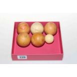 Five vintage ivory snooker balls and one smaller ball (5).