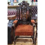 Large carved oak armchair with vine panel back.
