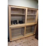 Ercol sliding glazed door bookcase/display, of double height with glass and wood shelves, 1.