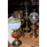 Collection of four late Victorian oil lamps including good vaseline shade.