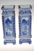 Pair of blue and white Chinese vases on stands, 43cm high.