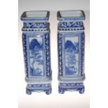 Pair of blue and white Chinese vases on stands, 43cm high.