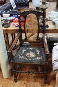 Oak barley twist armchair with cane back and needlework seat.