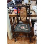 Oak barley twist armchair with cane back and needlework seat.