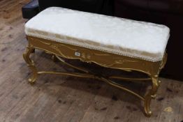 Giltwood duet stool on cabriole legs.