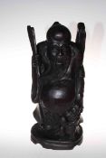 Large carved wood figure on an Oriental elder, 47cm high.