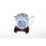 18th Century blue and white teapot on wood stand.