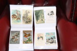 Two albums of early Christmas and New Year postcards, approximately 300 cards.