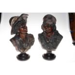 Pair of busts of children mounted on wood plinths, 45cm and 47cm.