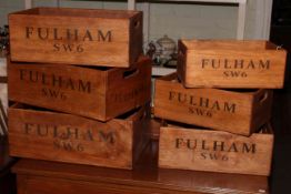 Set of six graduated Fulham SW6 wooden crates.