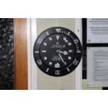 Circular kitchen wall clock marked Rolex.