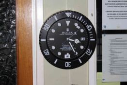 Circular kitchen wall clock marked Rolex.