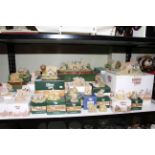 Collection of twenty four boxed Lilliput Lane models including Lancaster Station.