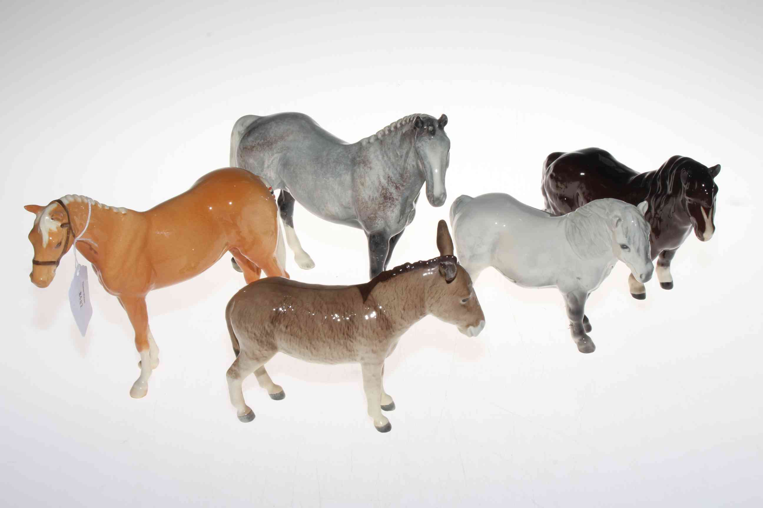 Two Beswick horses, two ponies and a donkey.
