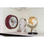 Esso clock, phrenology head and small globe.