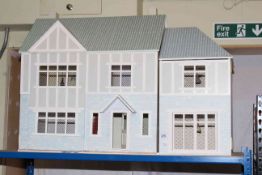 Dolls house fitted with electric.