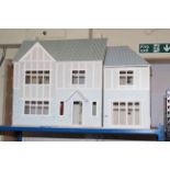 Dolls house fitted with electric.