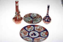 Japanese bottle vase, Imari bottle vase and two Imari plates.