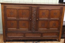 Large oak Arts and Crafts cupboard with double doors above hinged compartment, 1.88m wide, 1.