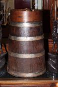 Elm and oak metal collared butter churn, 70cm high.