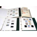 Three stamp albums housing GB used mint commemorative in folder,