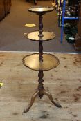 Mahogany three tier tripod stand.