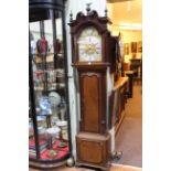 Antique oak and mahogany eight day longcase clock having brass and silvered arched dial,
