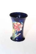 Small Moorcroft Pottery vase decorated with freesia on blue ground, 10.5cm high.