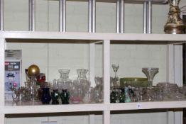 Collection of various clear and coloured glass, Coleman Duel Fuel lantern, candle holders, etc.