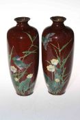 Pair of Japanese Meiji period cloisonne vases, decorated with birds on speckled ground, 24cm.