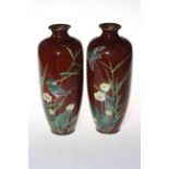 Pair of Japanese Meiji period cloisonne vases, decorated with birds on speckled ground, 24cm.