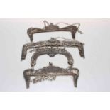 Four highly ornate Continental silver evening purse frames with chain handles, 23cm to 16cm across.
