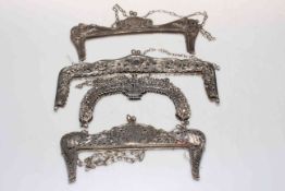 Four highly ornate Continental silver evening purse frames with chain handles, 23cm to 16cm across.