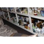 Full shelf of china, glass, ornaments, glass and stoneware bottles, teawares, etc.