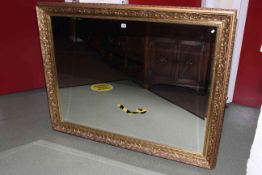 Large gilt framed bevelled wall mirror, 141cm by 110cm.