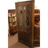 Jaycee leaded glass door standing corner cabinet.