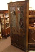 Jaycee leaded glass door standing corner cabinet.