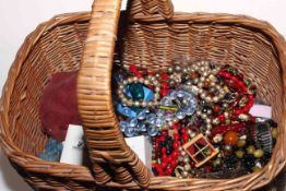 Basket of costume jewellery.