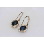 Pair of 14 carat yellow gold, sapphire and diamond earrings, 2.29 carat sapphires and 0.