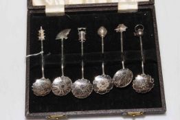 Cased set of six Oriental sterling silver ornate spoons.