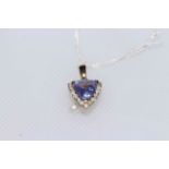 14 carat gold, brilliant cut tanzanite and 18 brilliant cut diamonds pendant,