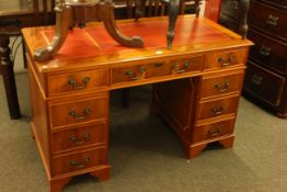 Yew eight drawer pedestal desk, 75.5cm by 122cm.